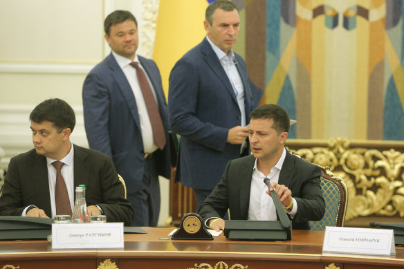 Serhiy Shefir, second from right, stands with other advisers at a meeting of the Ukrainian cabinet. 