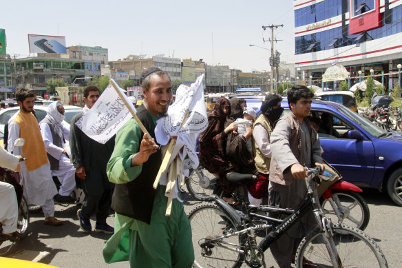 A man sells Taliban flags in Herat province, west of Kabul, Afghanistan, on Saturday, August 14.