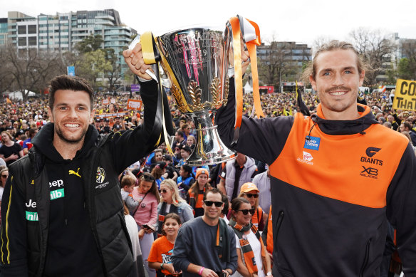 Captains Trent Cotchin and Phil Davis with the Premiership Cup.