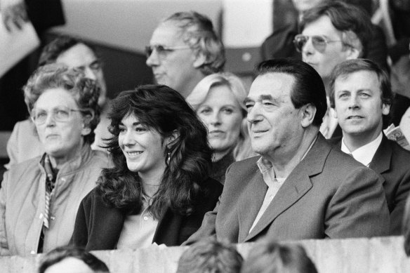 Ghislaine Maxwell and her father, the late media tycoon Robert Maxwell, watch a soccer match between Oxford United - which Robert Maxwell owned - and Brighton & Hove Albion in 1984.