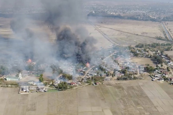 In this image taken from drone video provided by Free Burma Rangers, smoke rises from burning buildings in Waraisuplia, Kayah State, Myanmar on February 18.