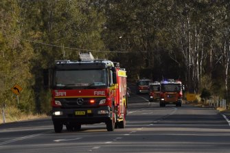 Fire trucks head north along The Lakes Way, north of Forster-Tuncurry.