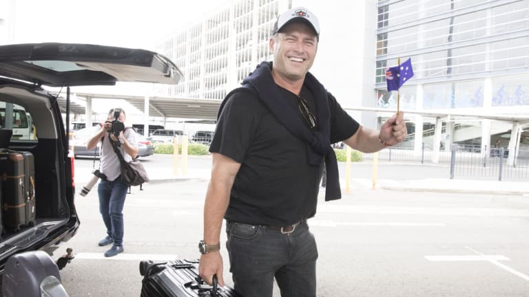 Stefanovic waved an Australian flag as he arrived back in the country on Friday.
