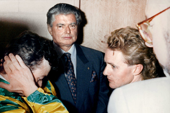 Bart Cummings looks on as jockeys Steven King (left, Let's Elope) and Shane Dye (right, Shiva's Revenge) await the stewards' decision following the 1991 Melbourne Cup.  
