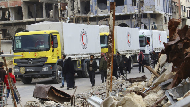 A convoy of Syrian Red Crescent trucks carrying humanitarian aid for civilians in Douma, eastern Ghouta, on Thursday.