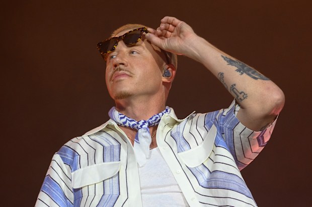 PARIS, FRANCE - JULY 19: American rapper Macklemore performs live on stage during the 5th Lollapalooza Paris Festival on July 19, 2025 in Paris, France. (Photo by Kristy Sparow/Getty Images)