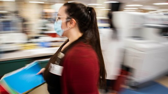 Sarah Shields, a patient account representative at the University of Vermont Medical Center in Burlington, Vt., runs paper lab orders  in November.
