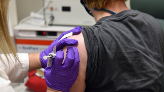 A patient enrolled in Pfizer's COVID-19 coronavirus vaccine clinical trial receives an injection. 