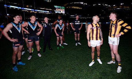 Ken Hinkley and James Sicily exchange words after Port Adelaide’s thrilling win.