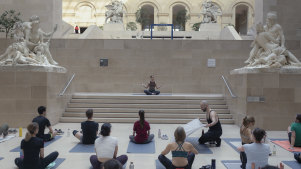 A yoga class, held before crowds arrive, in The Louvre Museum in Paris.