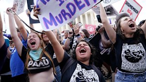 People celebrate the Supreme Court’s decision to end the constitutional protections for abortion.