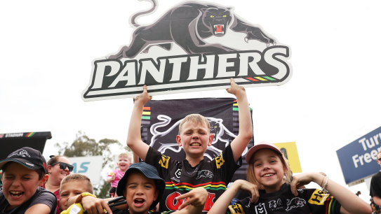 Young Panthers fans watch their idols at a grand final training session this week.