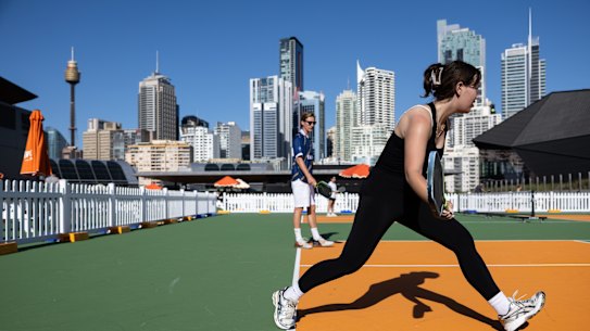 Pickleball players make the most of summer evenings at House of Pickle in Darling Harbour – part of a growing trend to embrace nights out with less alcohol.