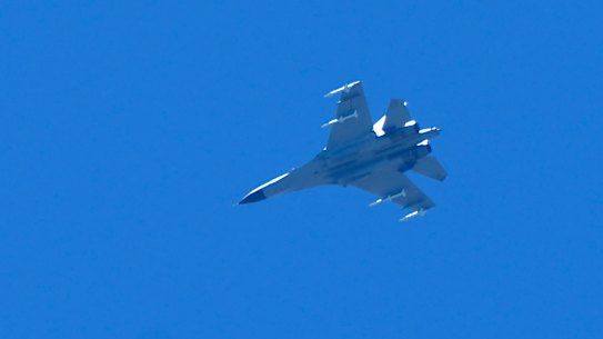 A fighter jet flies in the direction of Taiwan seen from the 68-nautical-mile scenic spot, the closest point in mainland China to the island of Taiwan, in Pingtan in southeastern China’s Fujian Province.