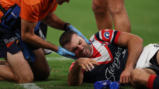 James Tedesco is treated for concussion after Bailey Simonsson’s high shot.