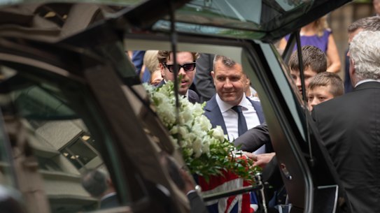 Former NSW premier Mike Baird farewells his father, former politician Bruce Baird, at his funeral at St Andrews Cathedral in Sydney.