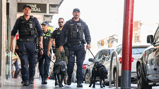 Police officers patrol Chapel Street. 