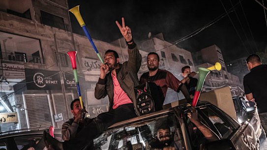 Palestinians in Gaza City celebrate the ceasefire agreement between Israel and Hamas on Friday.