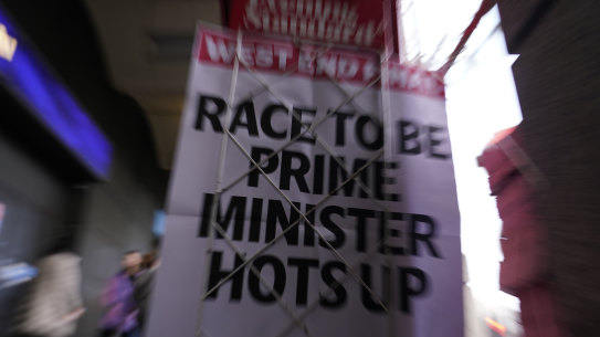 A newspaper poster for the London Evening Standard with the headline ′ Race to be Prime Minister Hots Up’ outside Westminster tube station in London.