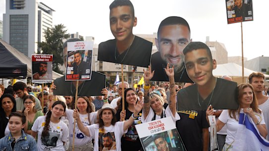Supporters in Tel Aviv prepare for the release of Edan Alexander, an American-Israeli soldier held hostage in Gaza.