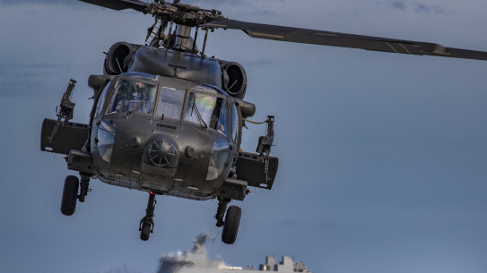 A Philippine Black Hawk helicopter takes off during a US naval exercise. 