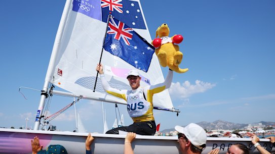 Matt Wearn’s teammates and support crew carried him back to shore aboard his boat like and all-conquering Viking warrior.