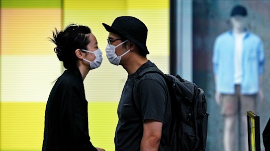 A Shanghai couple line up for COVID testing as the lockdown eases in the Chinese city.