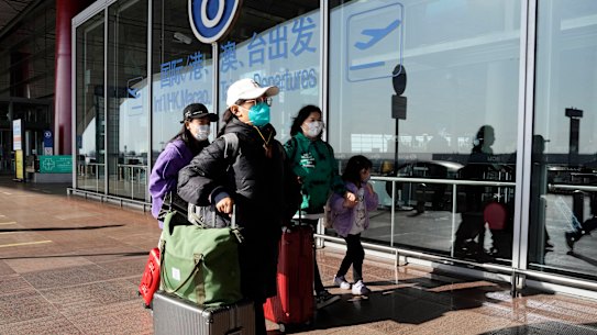 Passengers at the Capital airport terminal in Beijing.