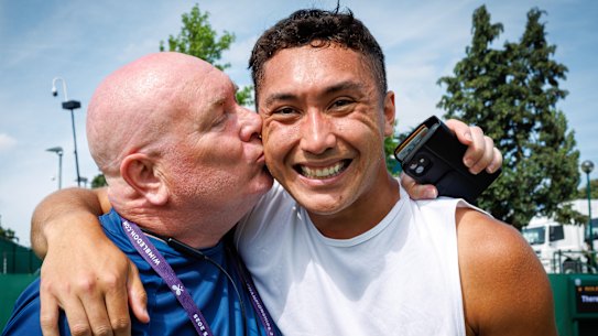 James McCabe’s father and coach Patrick plants a kiss on him after qualifying for Wimbledon.