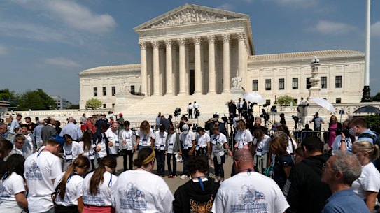 People pray outside of the US Supreme Court.