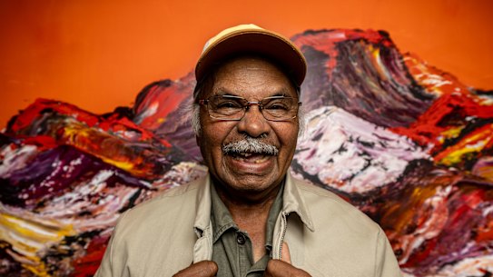 Artist and board member George Cooley with one of his works.