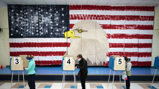 Voters cast their ballots under a giant mural at Robious Elementary School in Midlothian, Virginia in 2020.