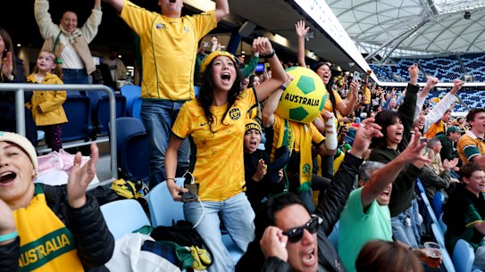 Socceroos fans celebrate Australia’s success against Turkey in the first match at the World Cup.