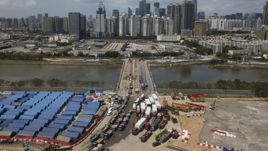 A construction site for coronavirus isolation facilities and a temporary bridge linked China’s Shenzhen and Hong Kong’s Lok Ma Chau cities in Hong Kong, 
