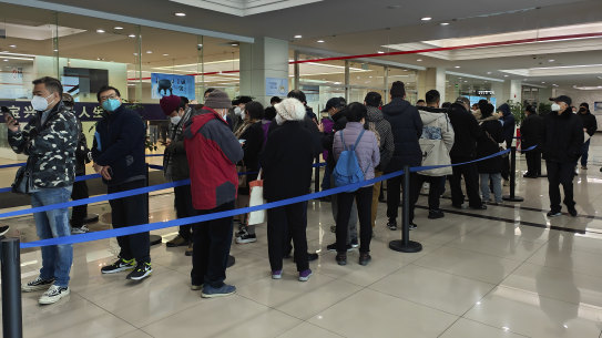 Family members of the deceased line up for the cremation procedures at a funeral home in Shanghai, China on January 4, 2023. 
