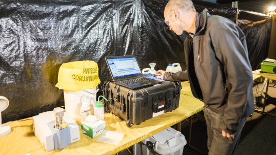 Senior pill-testing chemist Mal Mcleod demonstrates how a pill might be tested  at the Groovin' the Moo festival in April.