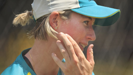 Beth Mooney explains to an onlooker where she fractured her jaw. 