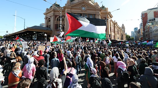 Protesters gathered in their thousands at Flinders Street Station on Thursday night.