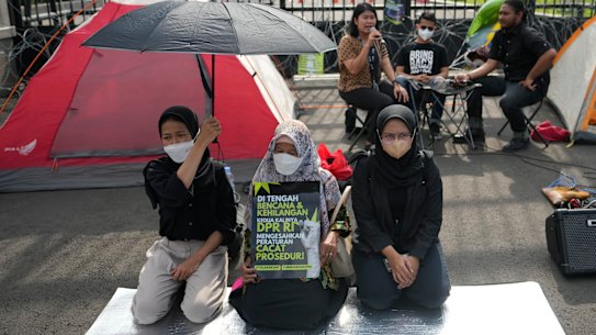 Activists protest in front of the parliament building in Jakarta this week.