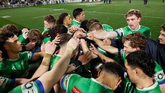 The Raiders take a moment after their victory in Mudgee.