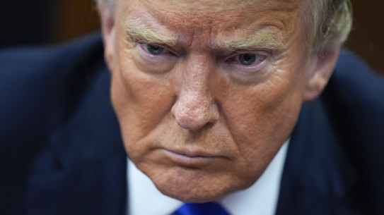 Former president Donald Trump appears at Manhattan criminal court in New York.