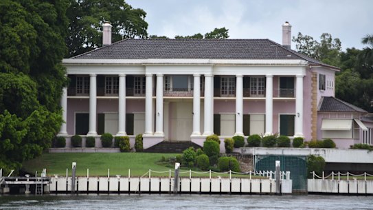 The view of the pink mansion from New Farm Park on the opposite side of the river.