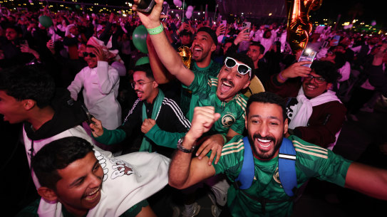 Fans celebrate as Saudi Arabia is announced as the host nation for the World Cup in 2034.