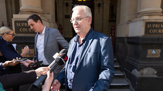 I Cook Foods owner Ian Cook (centre) outside the Supreme Court.