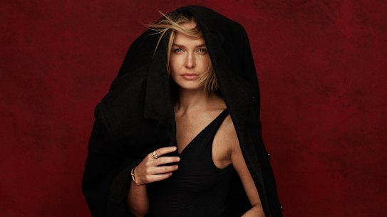 Lara wears Esse Studios coat, Seafolly “Seadive” swimsuit, Tiffany & Co jewellery.