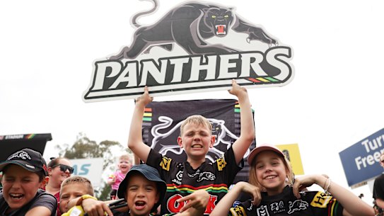 Young Panthers fans watch their idols at a grand final training session this week.