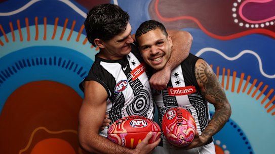 Teammates Lachie Schultz and Bobby Hill muck around at the launch of the AFL’s Sir Doug Nicholls round.