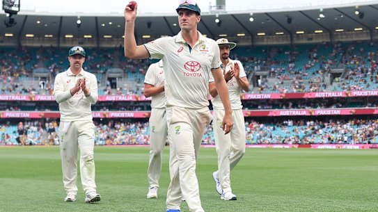 Pat Cummins leaves the field after taking his fifth wicket at the SCG on Wednesday.