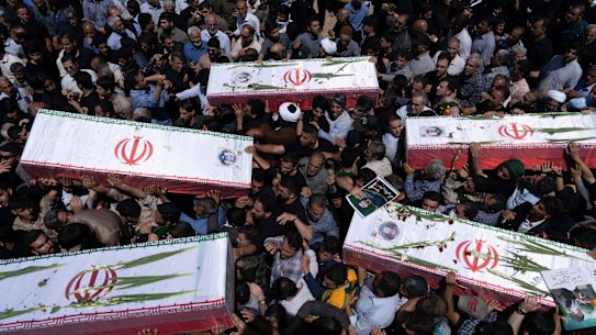 Mourners carry the flag-draped coffins of five men, whose names were not immediately available, reportedly killed in Israeli strikes, during their funeral in the city of Khorramabad, Iran, on Monday.