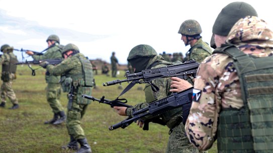 Russian Army recruits hold their weapons during a military training at a firing range in Donetsk on October 4.